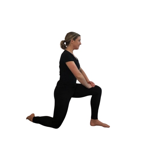 woman in black doing a hip flexor stretch.