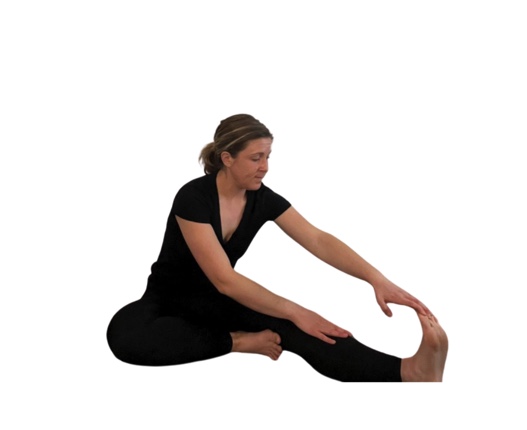 woman in black doing a hamstring stretch.