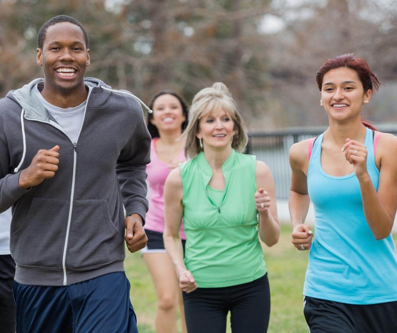 Group of people running outdoors