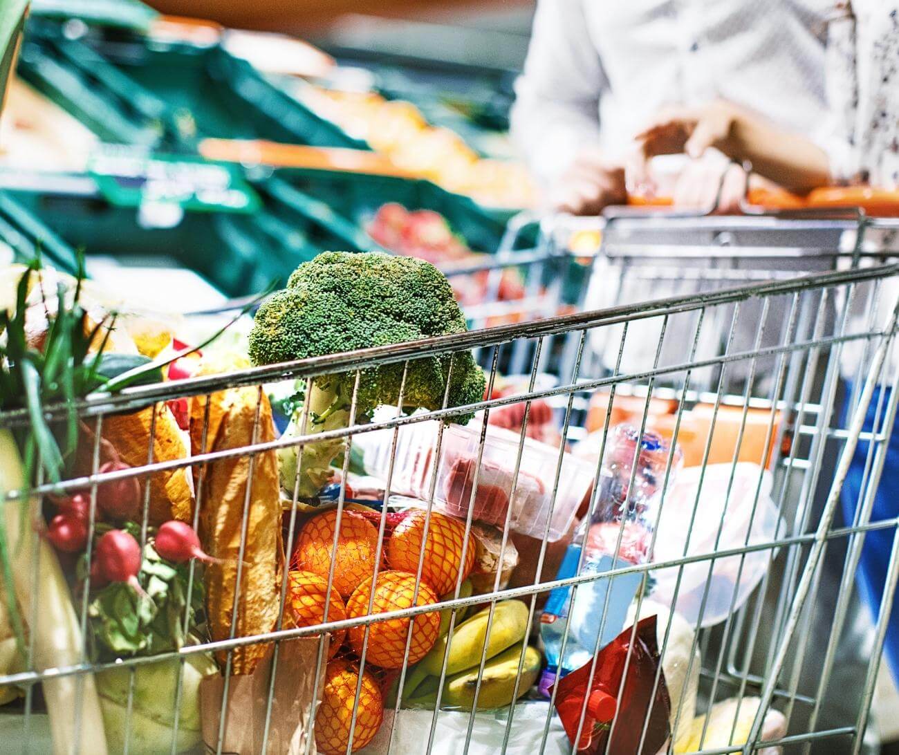 Shopping cart filled with fresh produce