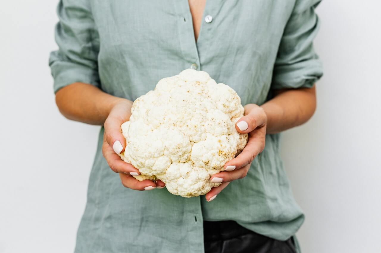 hands-holding-cauliflower