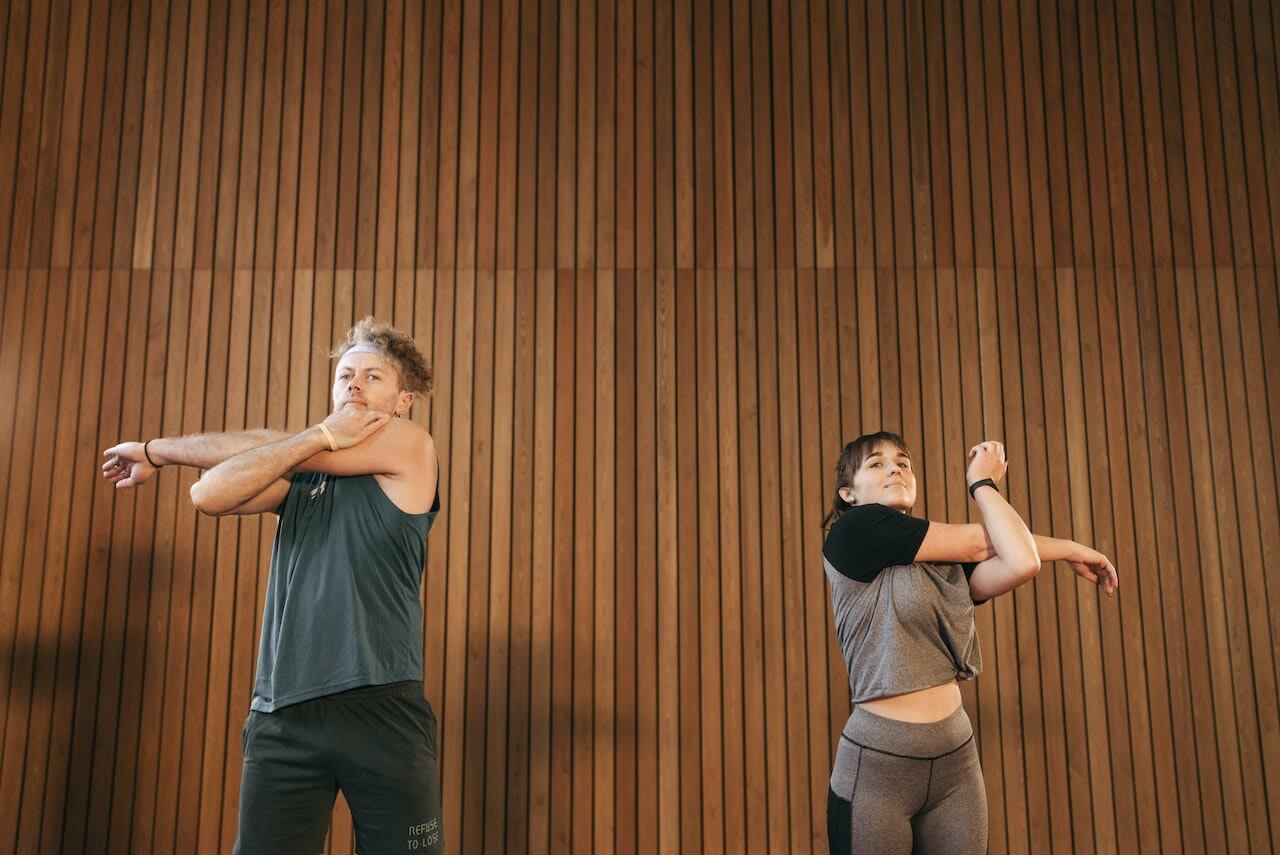 man-and-woman-stretching-after-hiit-work-out