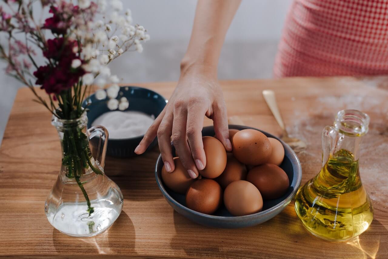 Person about to cook some eggs