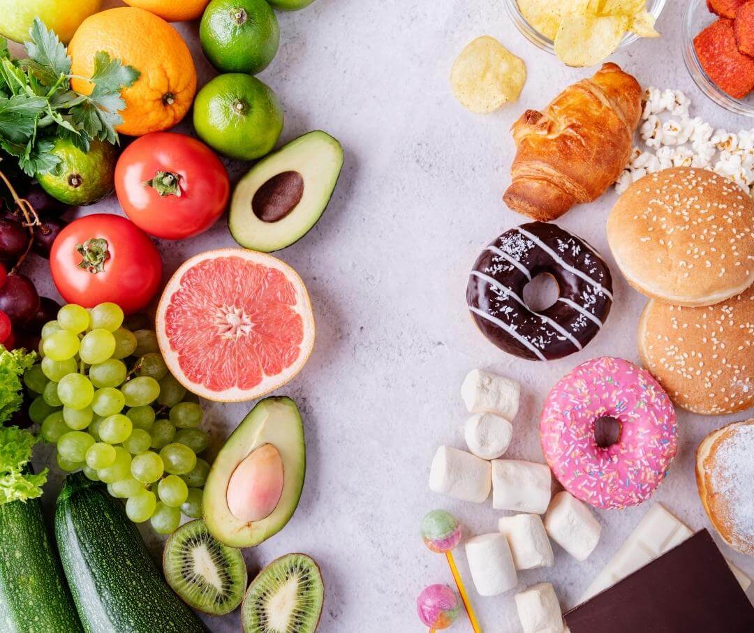 several types of fresh produce on the left and several types of junk food on the right