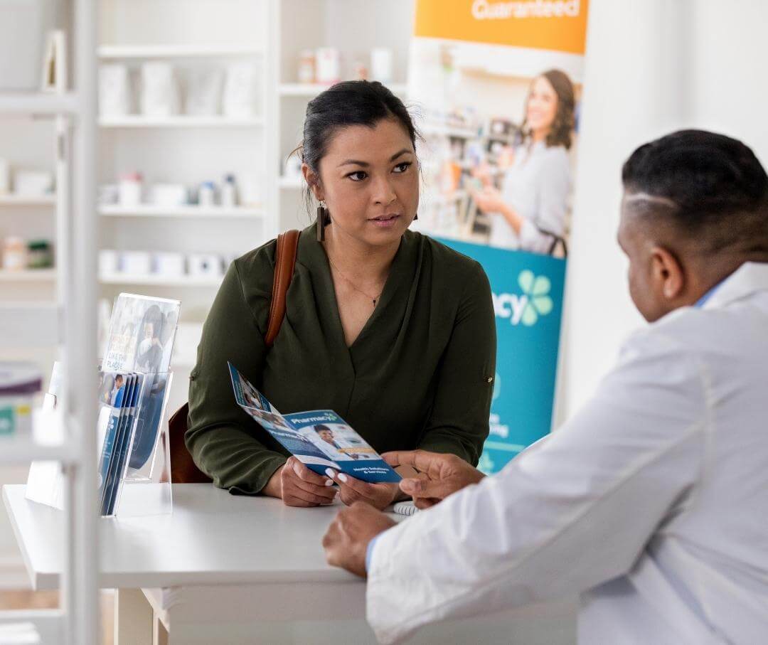 woman talking to a male pharmacist