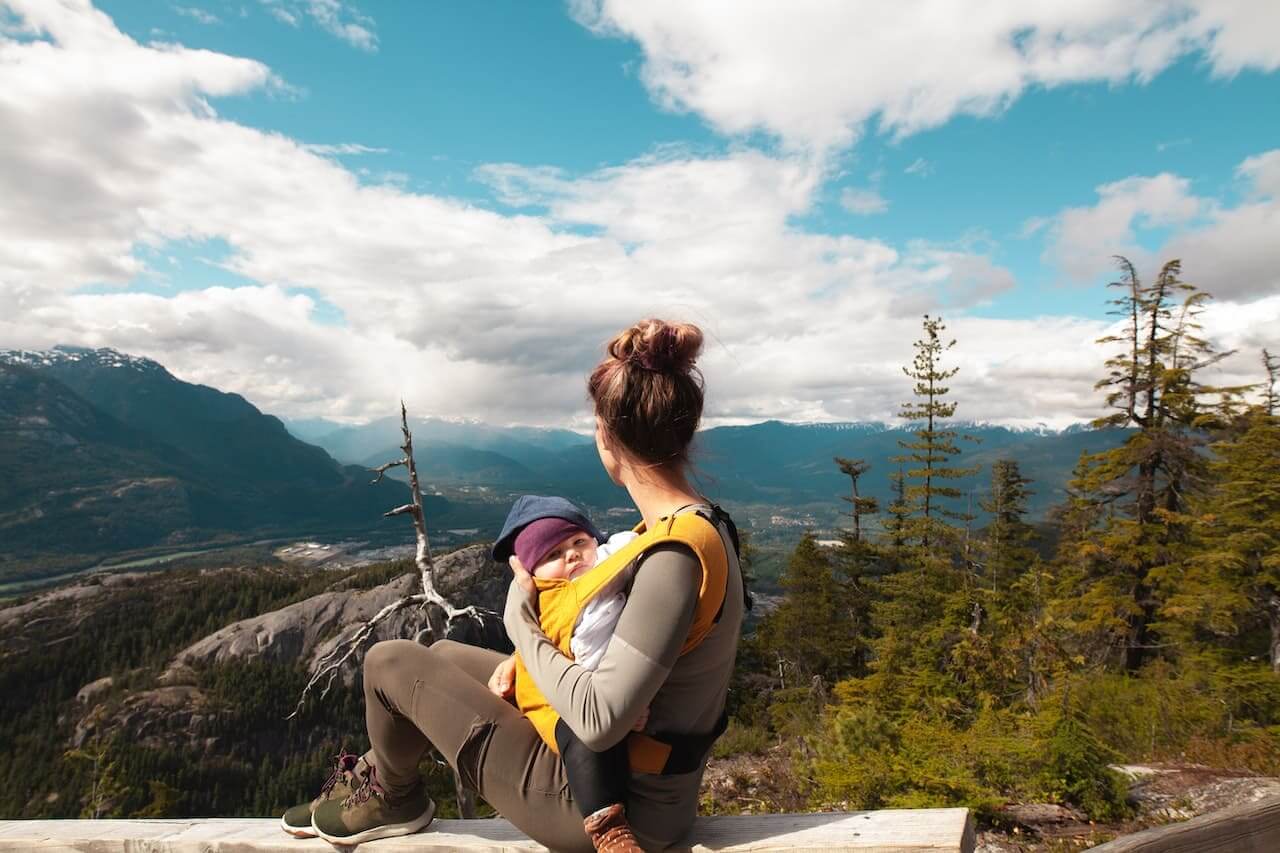 Mother-Carrying-Her-Baby-while-Looking-at-the-Nature-Scenery