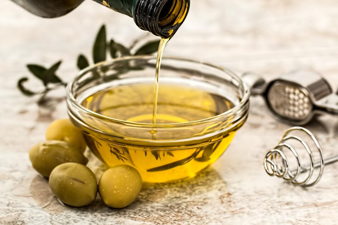 Bowl-Being-Poured-With-Olive-Oil