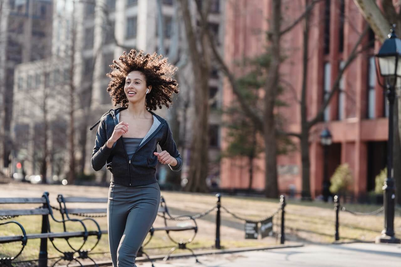 girl-with-curls-running-in-the-city