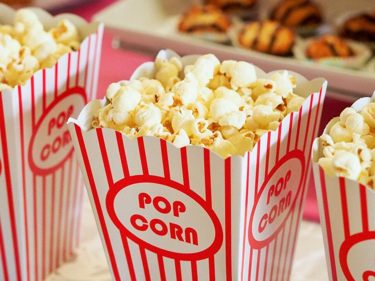 three-servings-of-popcorn-in-red-and-white-box