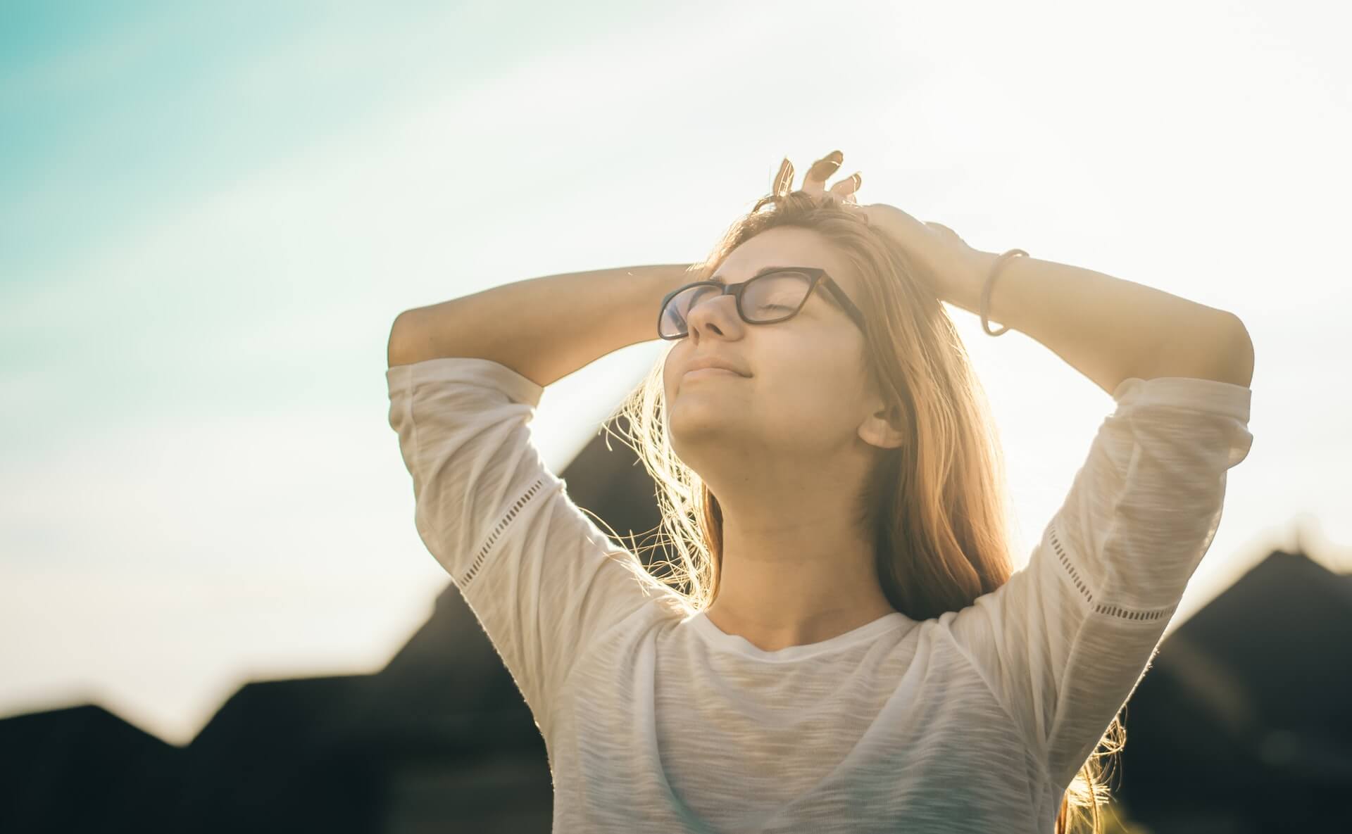 Relieved-woman-happy-outside-ginger-shot-benefits