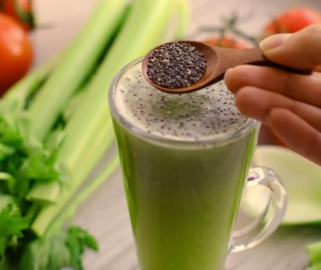 adding chia seeds to a green smoothie