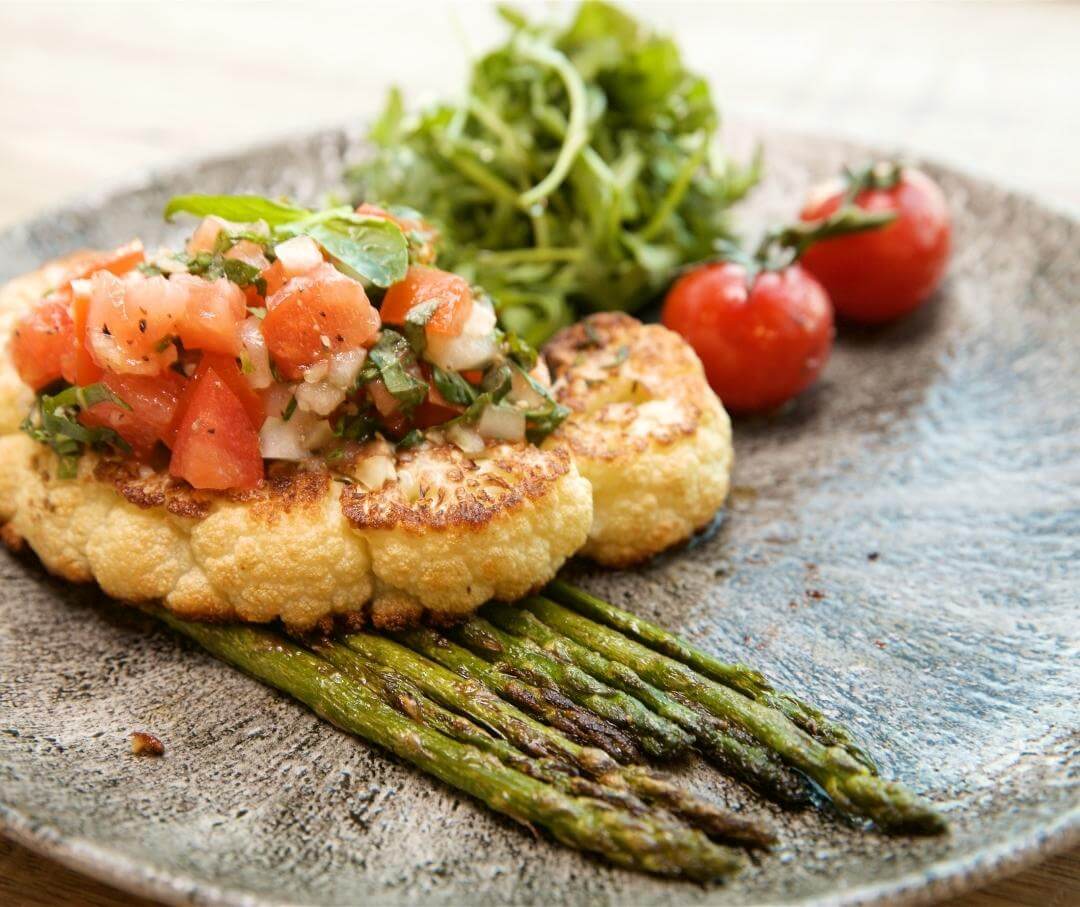 gilled cauliflower and asparagus topped with tomato salsa