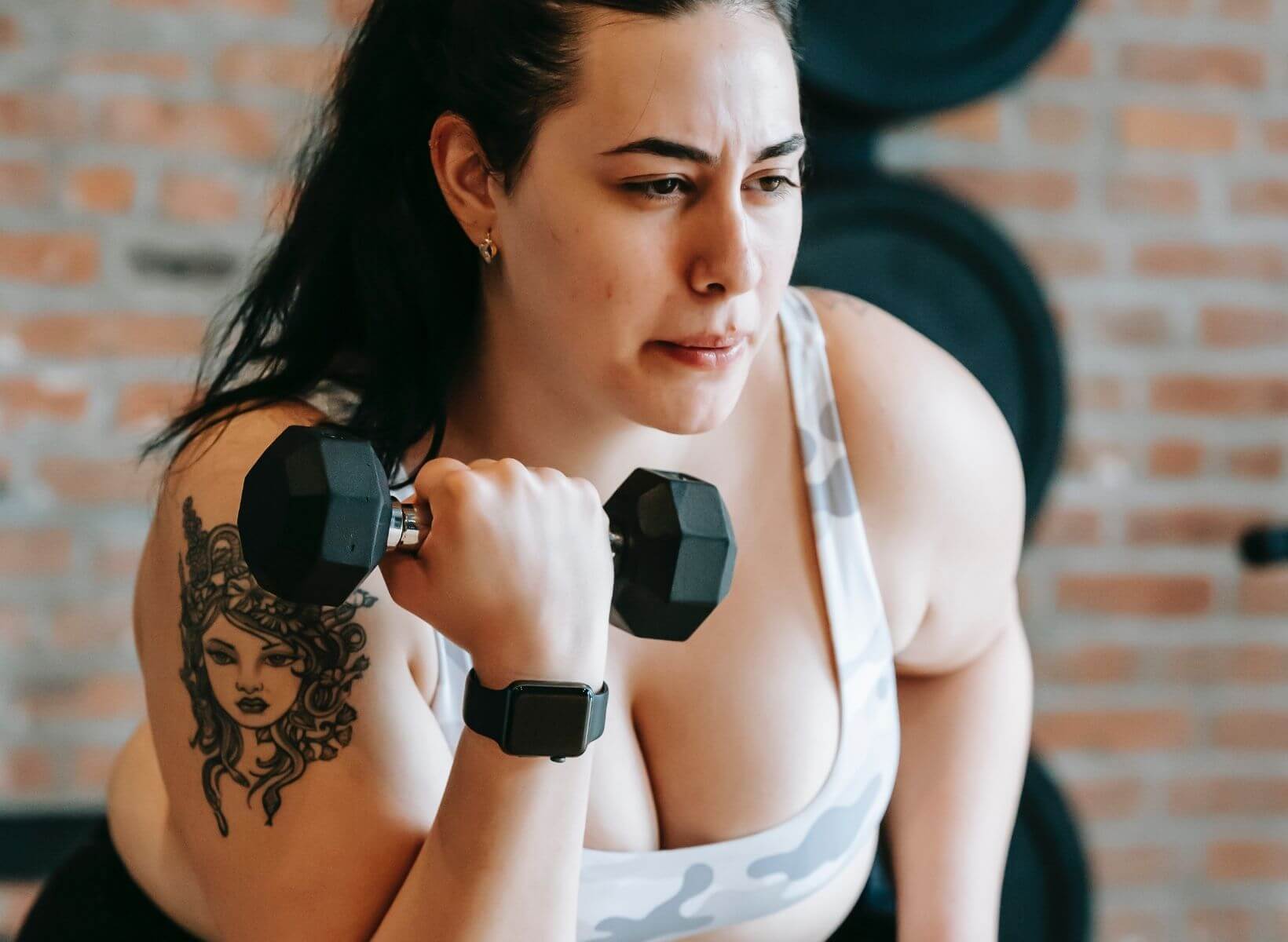 A woman doing a bicep curl