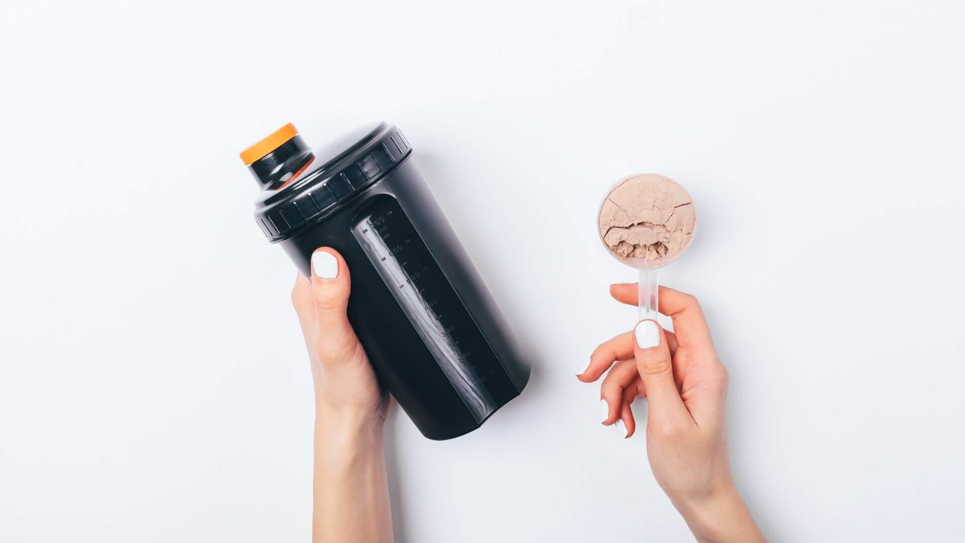 a woman holding a water bottle and a scoop of protein powder