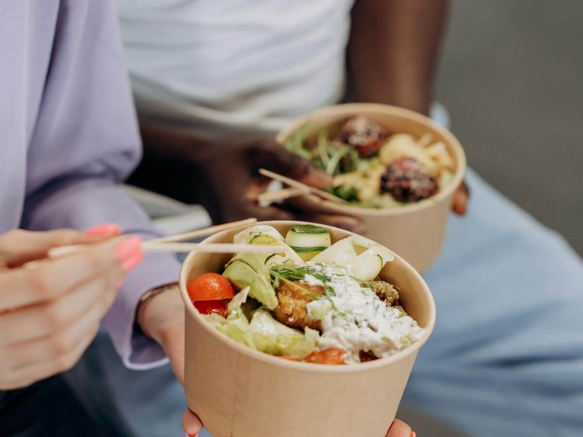 Couple eating fresh salad