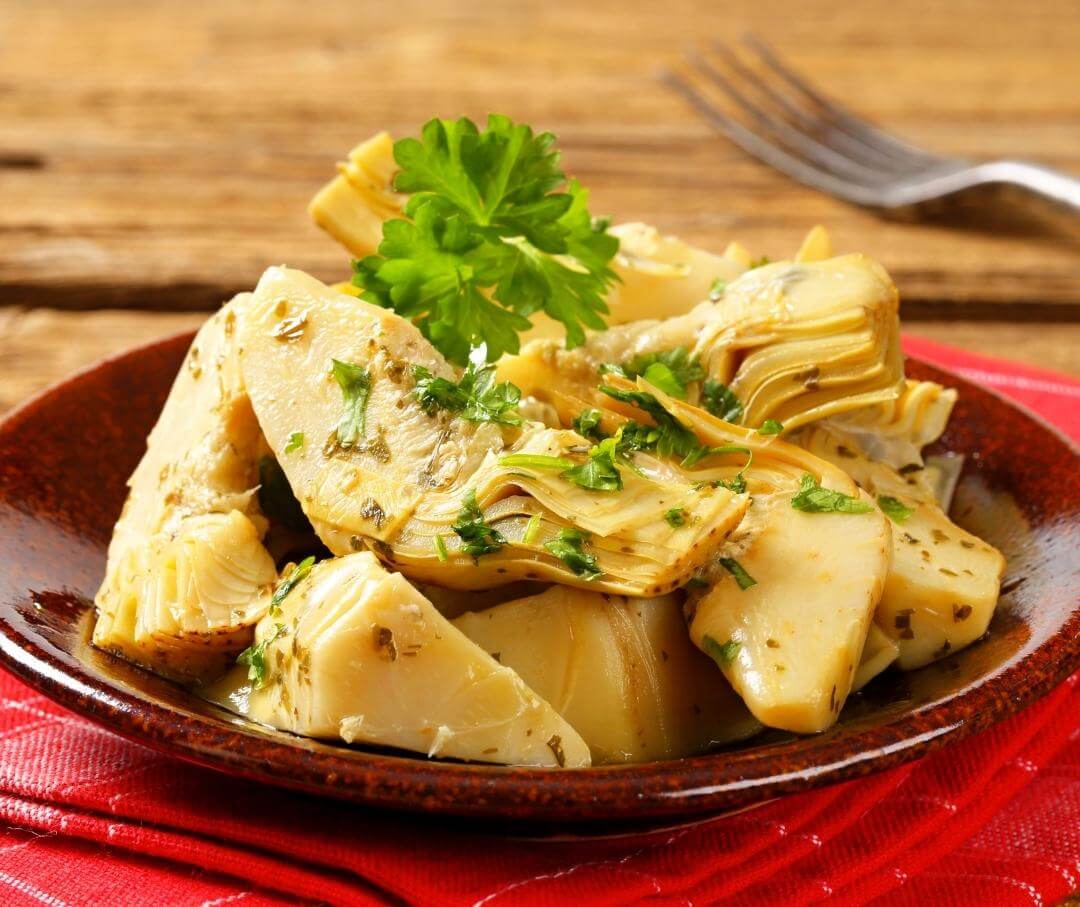 artichoke hearts with herbs in a dish